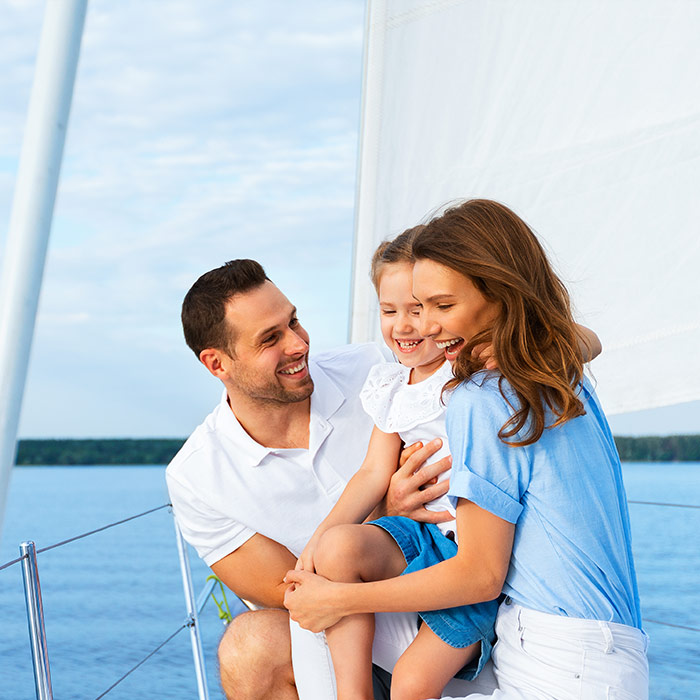 Family on yacht smiles