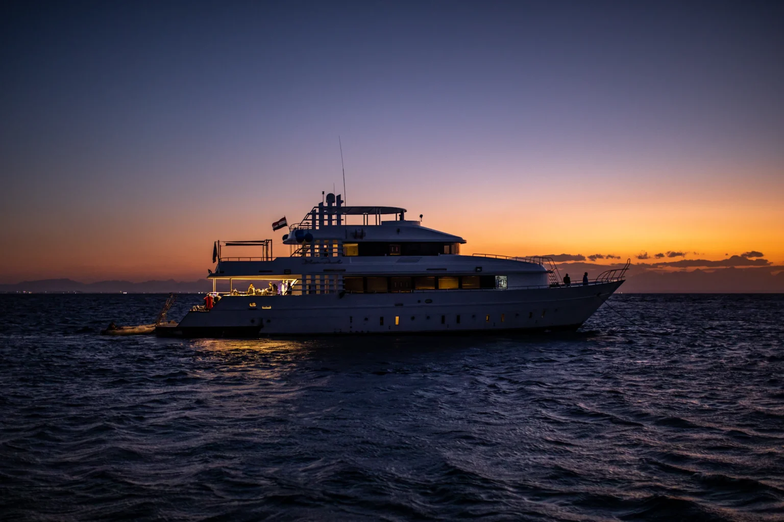 Yacht under way at sunset
