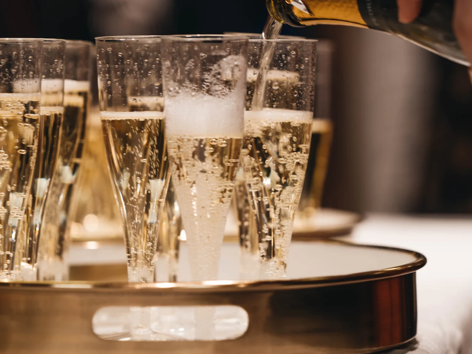 Champagne poured into glasses for a toast