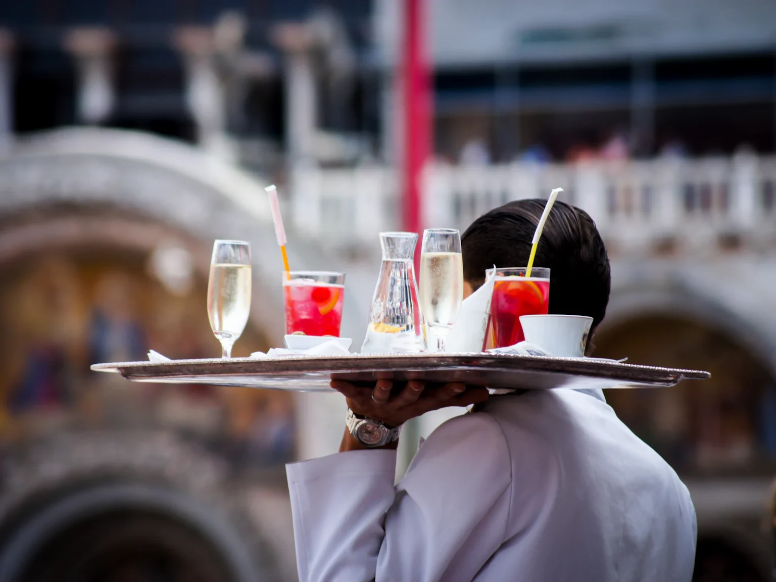 Waiter with a tray of aperitifs